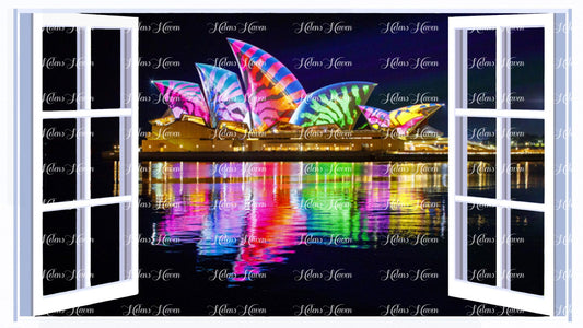 The Sydney Opera House with lights being projected onto it