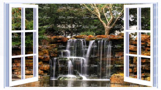 A waterfall set in a forest background with rocky lake