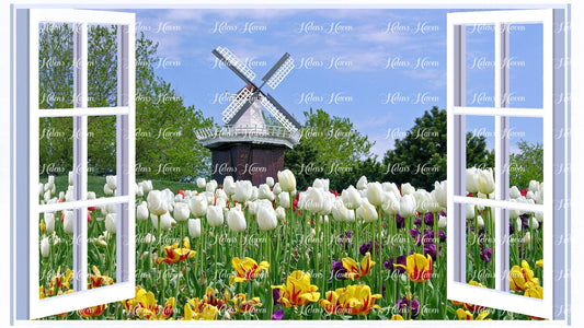 A windmill in a field of tulips