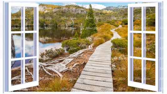 A path leads along a lake front into the wild