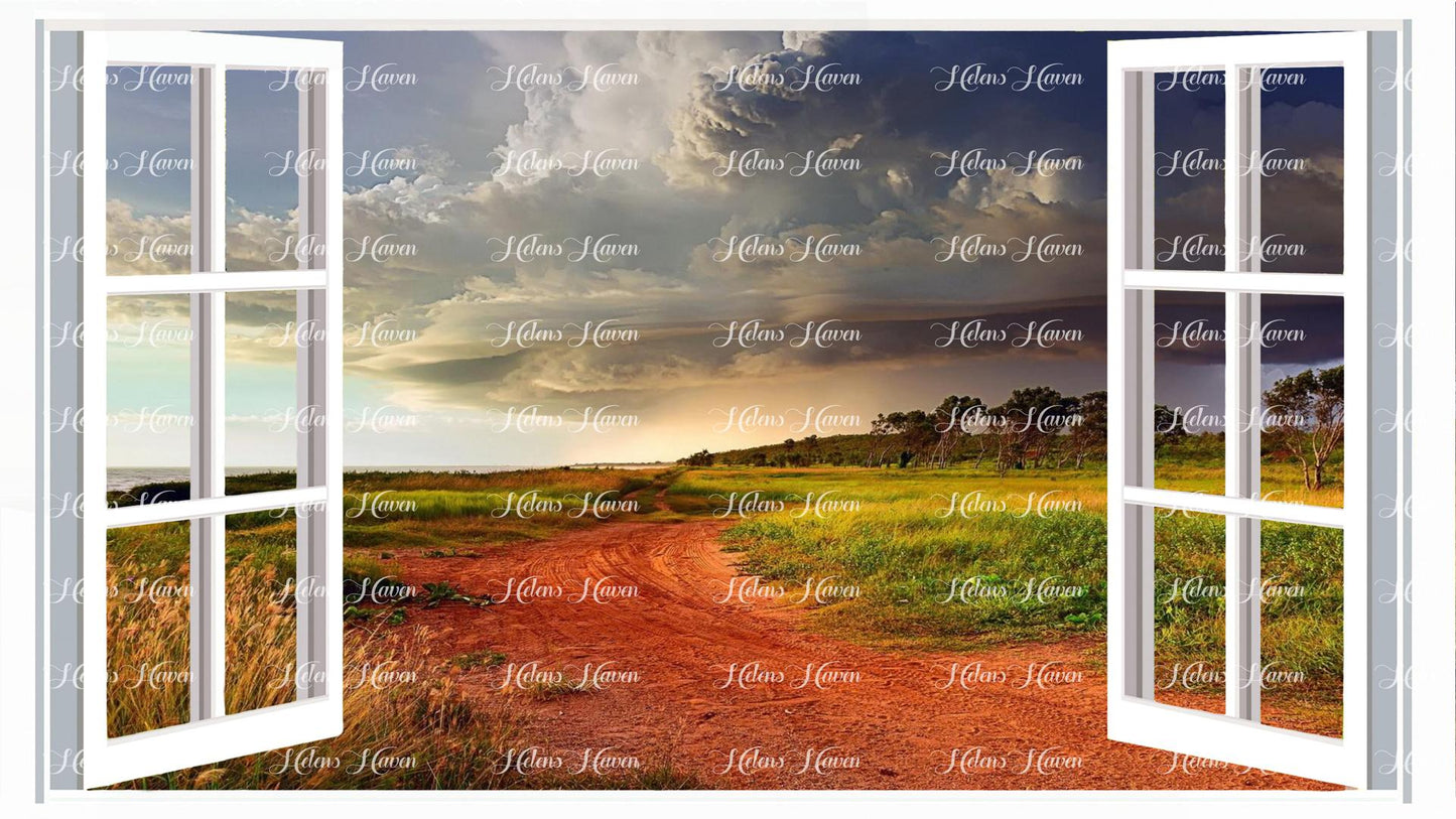 Storms gather over an Australian landscape with red soil