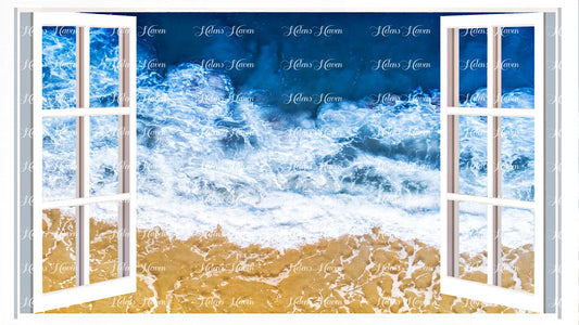 A view from above of waves crashing onto a beach with green water