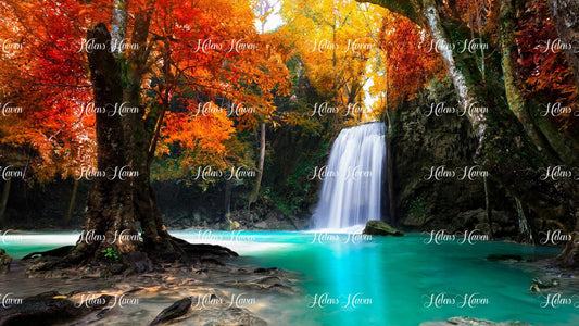 An autumn forest waterfall cascades down a rocky ledge, surrounded by a vibrant tapestry of fall colors