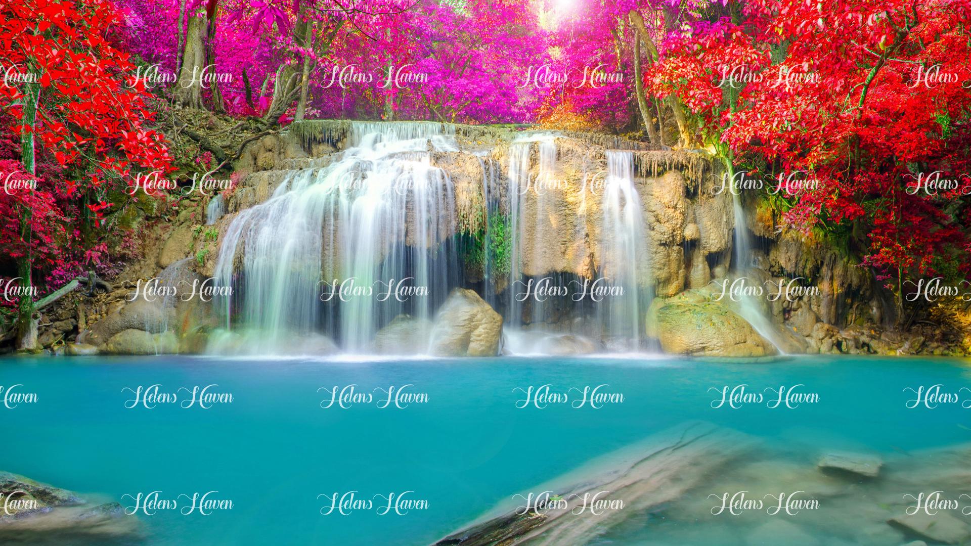 A waterfall cascades gracefully into a serene lagoon of aqua water, creating a breathtaking scene of natural beauty. 