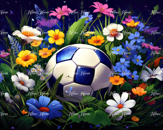 A soccer ball rests amidst a vibrant array of colorful flowers and lush foliage, creating a striking contrast between the sporty object and the natural beauty surrounding it