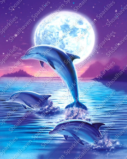 Three dolphins playfully leap from the water in front of a full moon