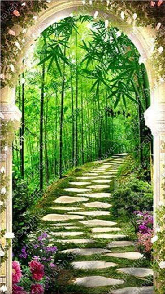 Grecian arches lead to a bamboo path with stones paving the way forward