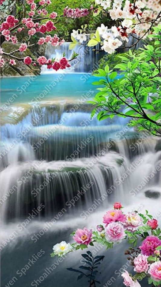 Cherry blossoms in the foreground of a beautiful waterfall scene