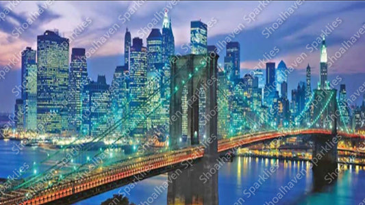 The Brooklyn bridge at night with Manhattan in the background