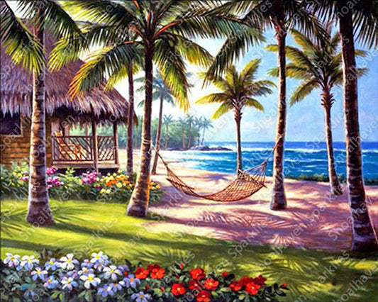 Scene of a beach on an island with a hammock strung between the trees