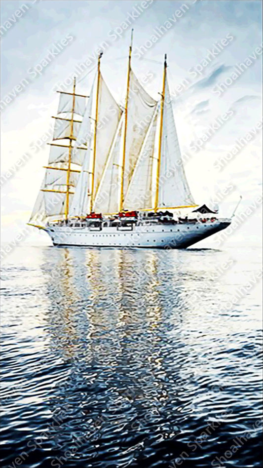 A tall ship with reflections of the sails on the water 