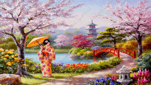 A geisha stands under a cherry blossom tree in a Japanese landscape